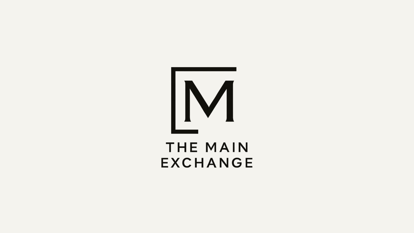 The Main Exchange logo — Sheridan, Wyoming boutique lodging